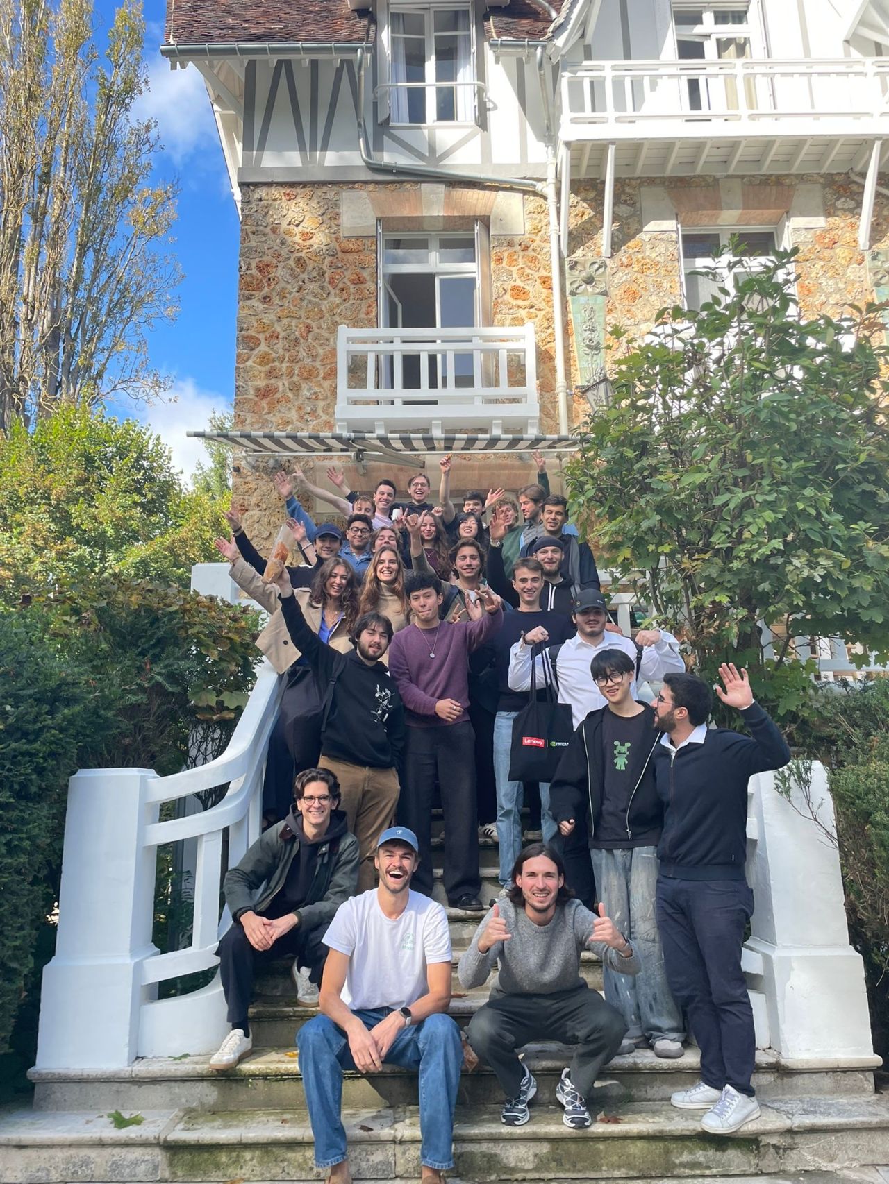 Builders Retreat Paris group photo on villa steps